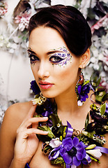 Image showing floral face art with anemone in jewelry, sensual young brunette 