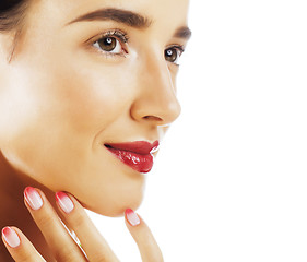 Image showing young pretty brunette woman with red flower amaryllis close up i