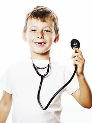 Image showing little cute boy with stethoscope playing like adult profession d