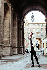 Image showing young pretty stylish teenage girl outside on city street fancy f