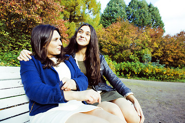 Image showing mature real mother with daughter outside autumn fall in park