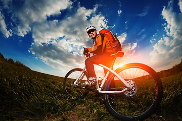Image showing cyclist riding bike on a nature trail in the mountains.