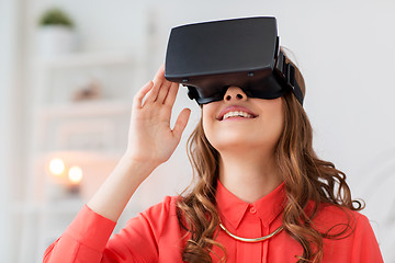 Image showing happy woman in virtual reality headset at home