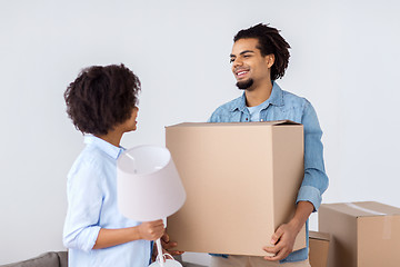 Image showing happy couple with stuff moving to new home