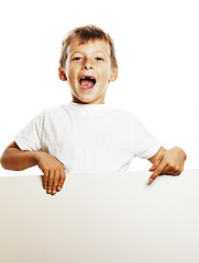 Image showing little cute boy holding empty shit to copyspace isolated close u