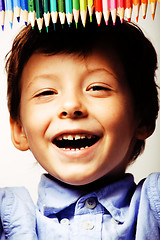 Image showing little cute boy with color pencils close up smiling, education f