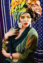 Image showing beauty bright woman with creative make up, many shawls on head l