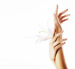 Image showing beauty delicate hands with manicure holding flower lily close up