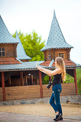 Image showing Young traveling woman in country