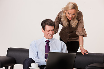 Image showing Young Woman And Man with a notebook