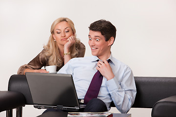 Image showing Young Woman And Man with a notebook