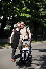 Image showing couple with baby pram in summer park