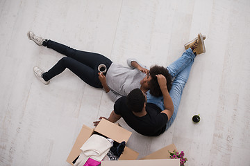 Image showing African American couple relaxing in new house