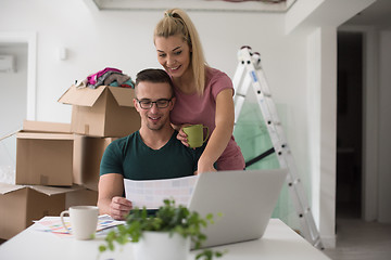 Image showing Young couple moving in a new home