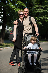 Image showing couple with baby pram in summer park