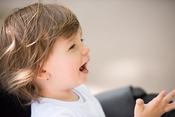 Image showing baby girl sitting in the pram