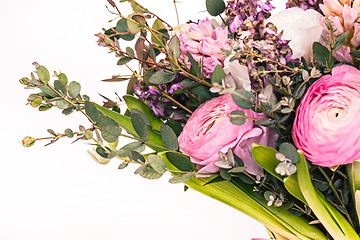 Image showing Ranunkulyus bouquet of red flowers on a white background