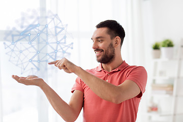 Image showing man with virtual polygonal projection at home