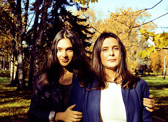 Image showing mature real mother with daughter outside autumn fall in park