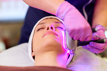 Image showing young woman having face microdermabrasion at spa