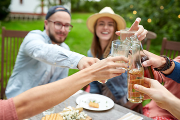 Image showing happy friends with drinks at summer garden party