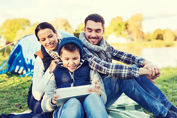 Image showing happy family with tablet pc and tent at camp site