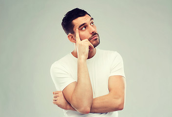 Image showing man thinking over gray background