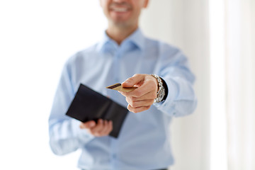 Image showing close up of businessman with credit card