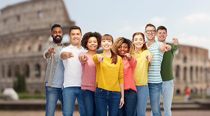 Image showing international group of people pointing on you