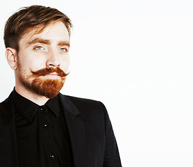 Image showing young red hair man with beard and mustache in black suit on whit