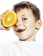 Image showing little cute boy with orange fruit double isolated on white smili