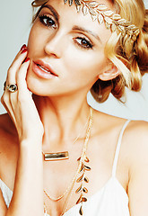 Image showing young blond woman dressed like ancient greek godess, gold jewelr