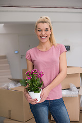 Image showing girl moving in the new apartment