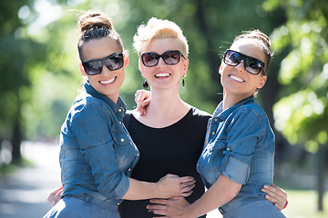Image showing portrait of three young beautiful woman with sunglasses