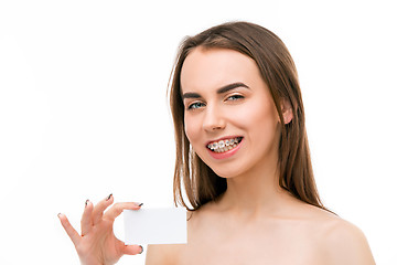 Image showing Beautiful young woman with teeth braces