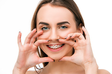 Image showing Beautiful young woman with teeth braces