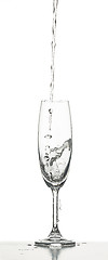 Image showing The water splashing to glass on white background