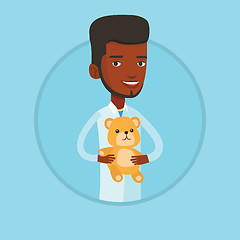 Image showing Pediatrician doctor holding teddy bear.