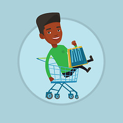 Image showing Happy man riding by shopping trolley.