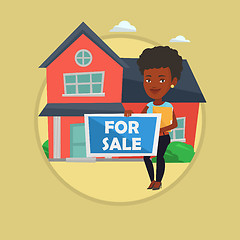 Image showing Young female realtor offering house.