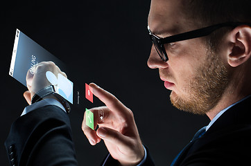 Image showing close up of businessman with smartwatch