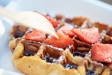 Image showing waffle with strawberry and sauce