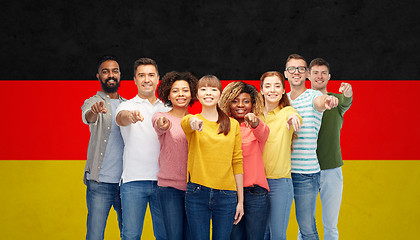 Image showing international group of people pointing on you