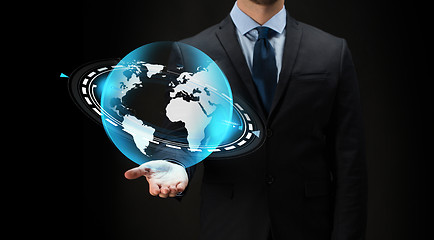 Image showing businessman with virtual earth projection