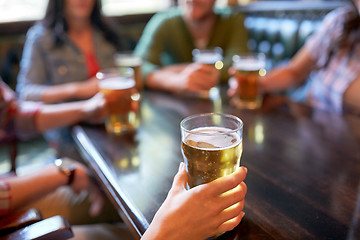Image showing friends drinking beer at bar or pub
