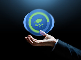 Image showing close up of businessman hand with eco icon