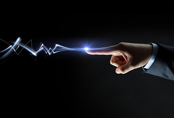 Image showing businessman finger connecting to lightning