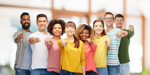 Image showing international group of people pointing on you