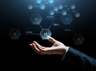 Image showing close up of businessman hand with molecule