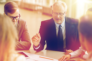 Image showing architects with tablet pc and blueprint at office